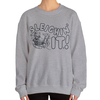 Women's Heavy Sweatshirt – "Sleighin It" Fun and Festive Christmas Graphic Sweatshirt