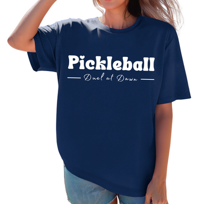 Eddy and Rita Women's Heavy Cotton T-Shirt - "Pickleball Duel at Dawn" Graphic Tee for Pickleball Enthusiasts