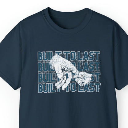 Built to Last Men's Tee: Father's Hand Holding Child's Promise - Eddy and Rita